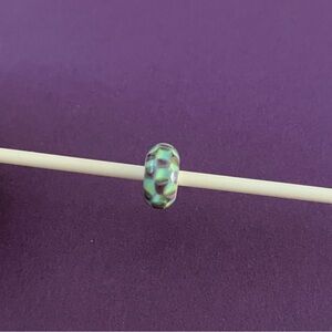Trollbeads Retired turquoise and purple chess board bead. TGLBE-10242.